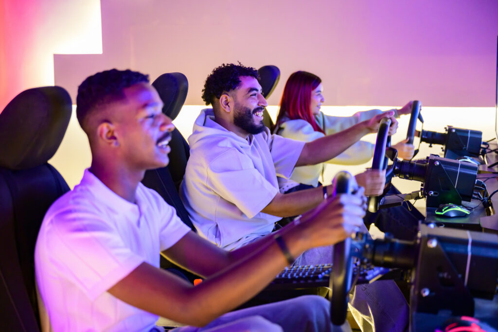 male friends playing racing video game