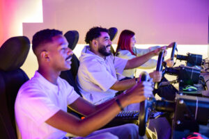 male friends playing racing video game
